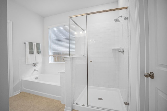 bathroom featuring tile patterned floors and plus walk in shower