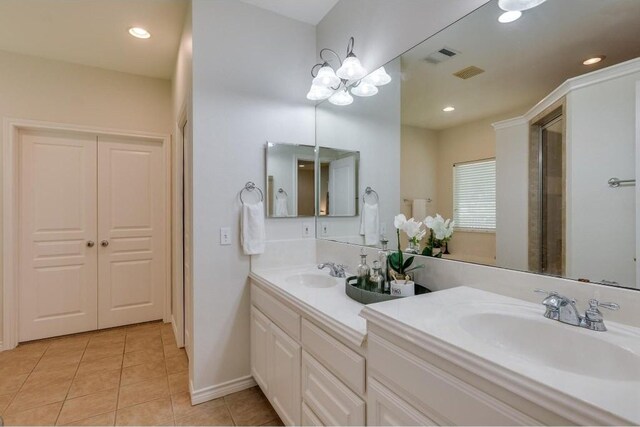 bathroom featuring double vanity and tile patterned flooring