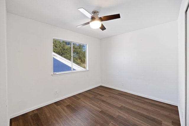 unfurnished room featuring dark hardwood / wood-style flooring and ceiling fan