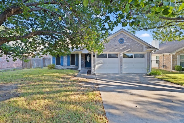 view of front of house featuring a garage and a front yard