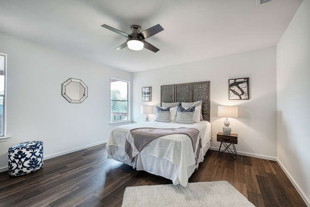 bedroom with dark wood-type flooring and ceiling fan