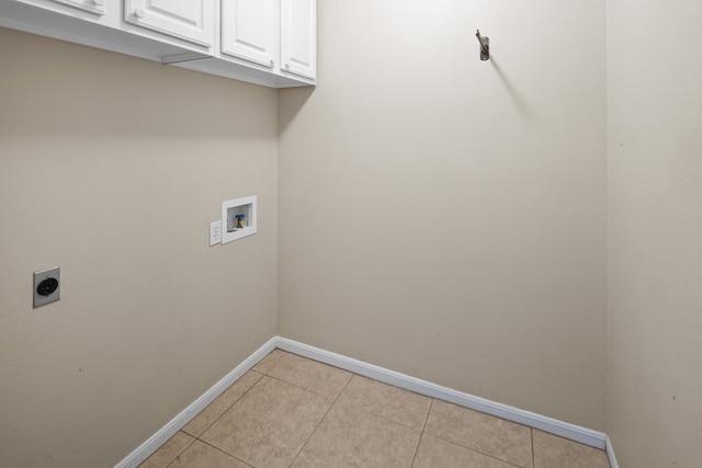 laundry area with cabinets, washer hookup, light tile floors, and electric dryer hookup