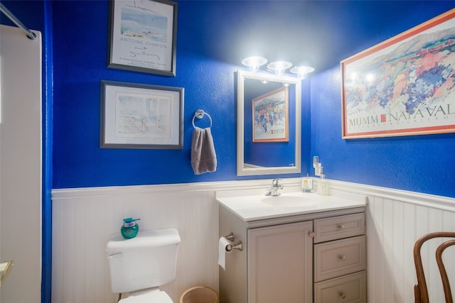 bathroom featuring toilet and vanity