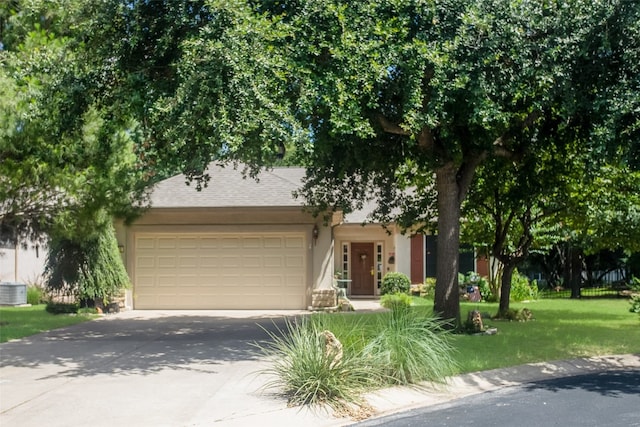 view of front of home featuring a garage and a front yard