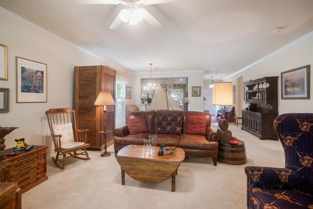 living room featuring ceiling fan, light colored carpet, and crown molding