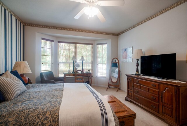 bedroom featuring light colored carpet and ceiling fan