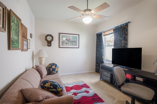 carpeted living room featuring ceiling fan