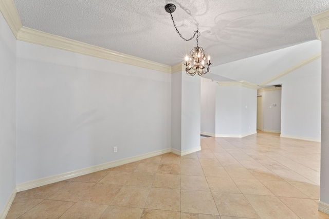 empty room featuring a textured ceiling, a chandelier, light tile patterned floors, and ornamental molding