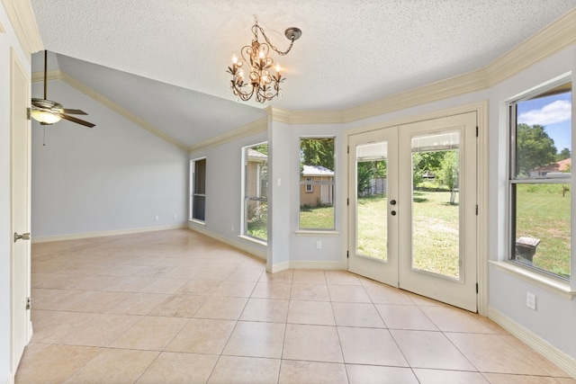 interior space with french doors, a textured ceiling, vaulted ceiling, crown molding, and light tile patterned floors