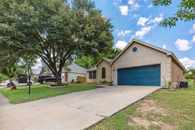 view of front of home featuring central AC unit, a garage, and a front lawn