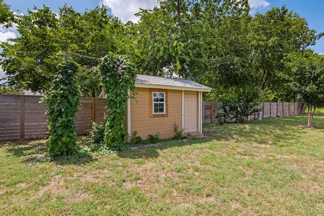 view of outdoor structure featuring a lawn