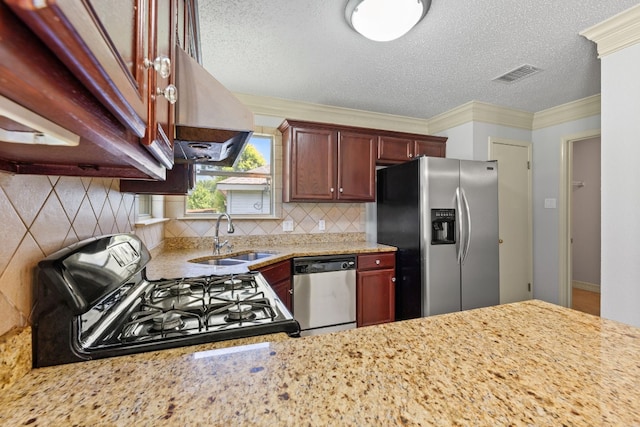 kitchen featuring sink, appliances with stainless steel finishes, light stone countertops, and decorative backsplash