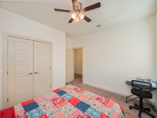 bedroom featuring carpet floors, a closet, and ceiling fan