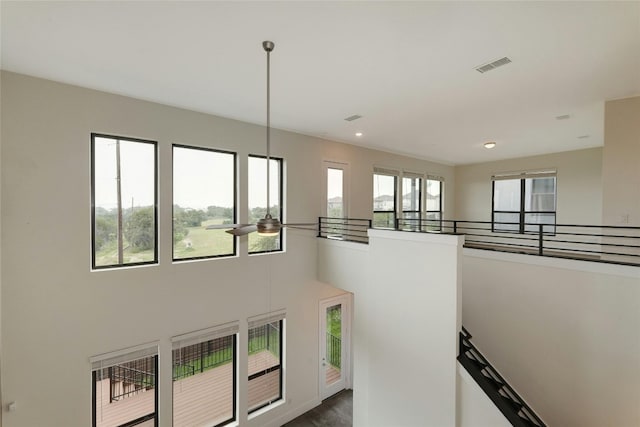 interior space featuring visible vents and a high ceiling