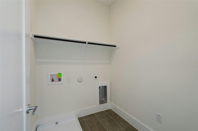 clothes washing area with laundry area, hookup for a washing machine, hookup for a gas dryer, electric dryer hookup, and dark tile patterned flooring