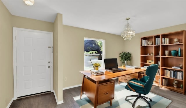 office space with dark hardwood / wood-style floors and a chandelier