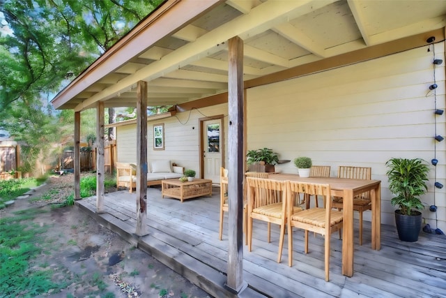 wooden terrace featuring outdoor lounge area