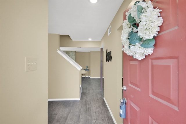 foyer entrance with baseboards, wood finished floors, stairs, and recessed lighting
