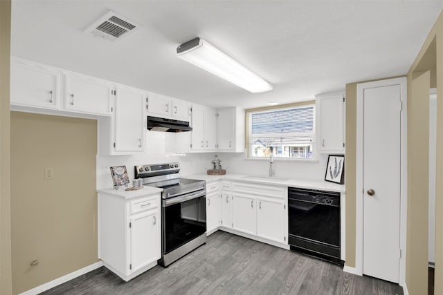 kitchen featuring dishwasher, stainless steel electric stove, a sink, under cabinet range hood, and wood finished floors
