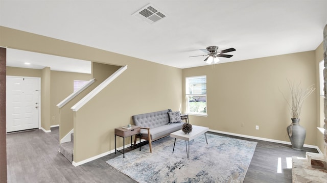 12002 Hardwood Trl, Austin, TX 78750 - sitting room with wood finished floors, ceiling fan, stairway, and baseboards