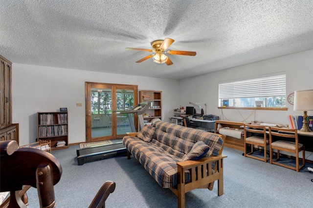 living room with light carpet, a textured ceiling, and a healthy amount of sunlight