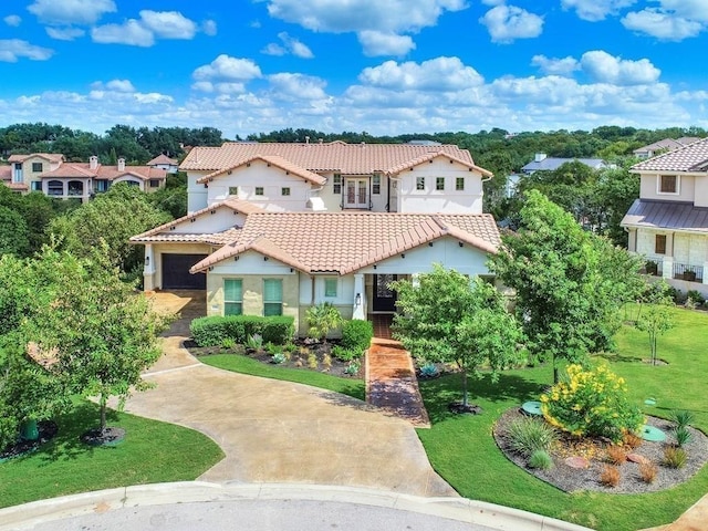 mediterranean / spanish-style house featuring a front yard