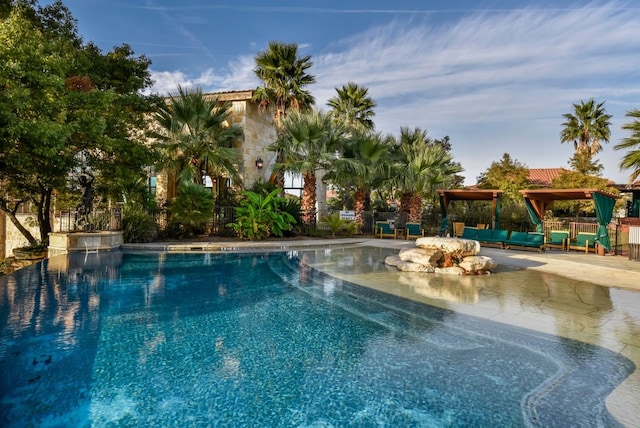 view of swimming pool featuring a gazebo and a patio area