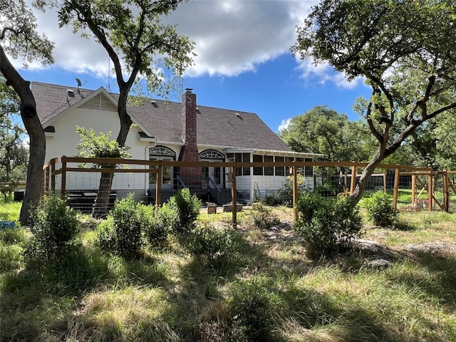 back of property featuring a deck