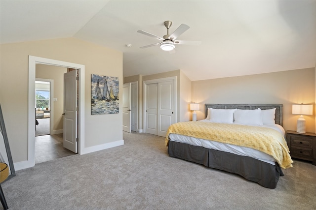 carpeted bedroom featuring lofted ceiling and ceiling fan