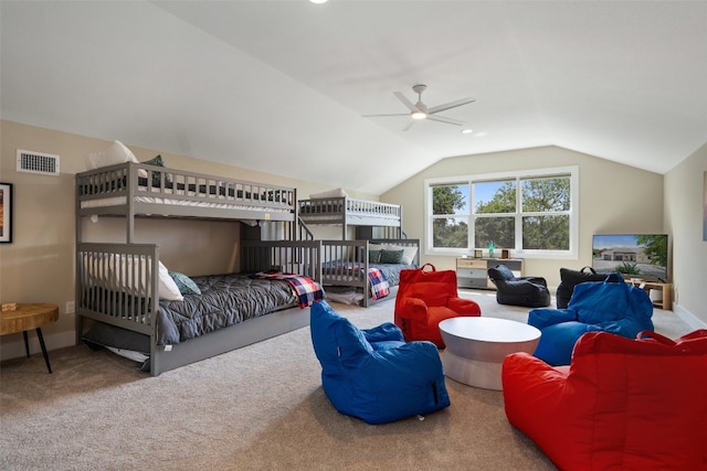 carpeted bedroom with ceiling fan and lofted ceiling