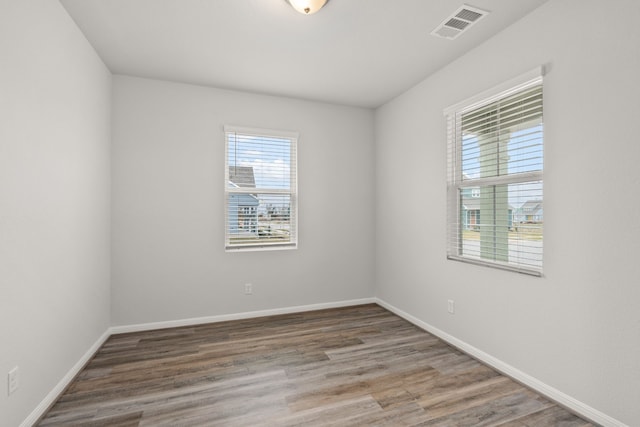 empty room featuring hardwood / wood-style flooring