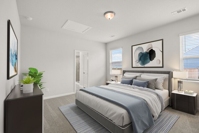 carpeted bedroom featuring ensuite bath