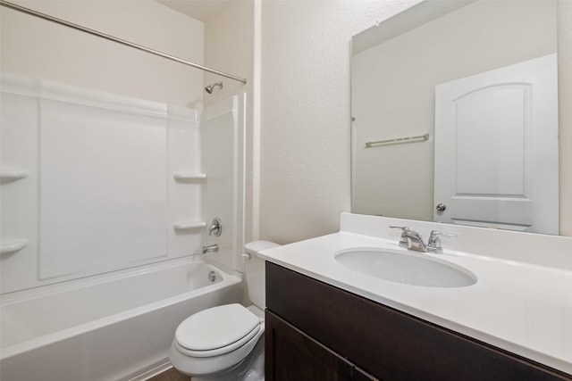 full bathroom featuring toilet, vanity, and tub / shower combination