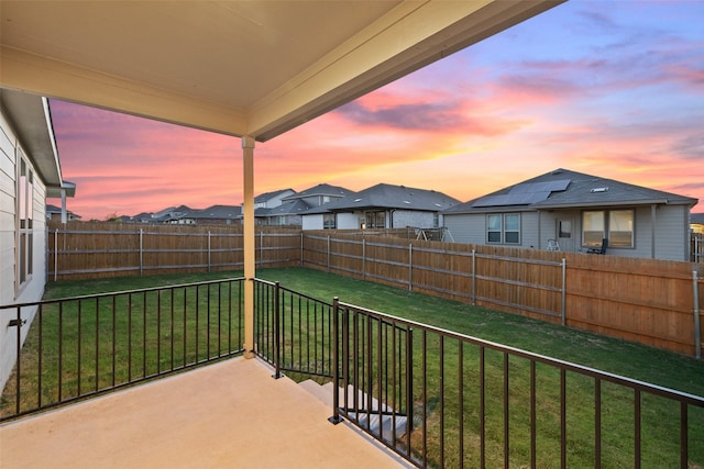 view of balcony at dusk