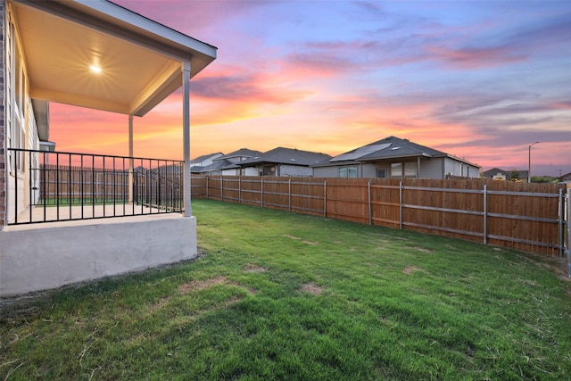 view of yard at dusk