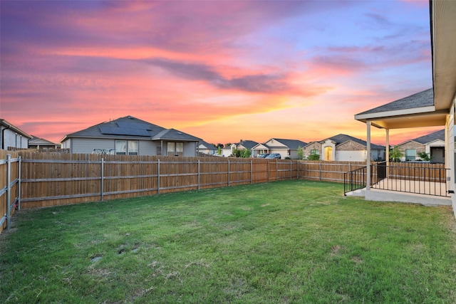 view of yard at dusk