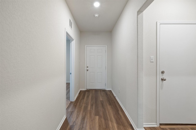 hall featuring dark wood-type flooring