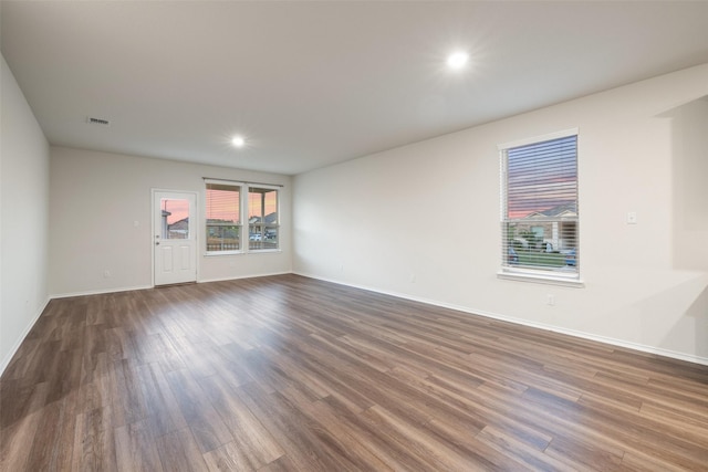 unfurnished room featuring dark hardwood / wood-style floors