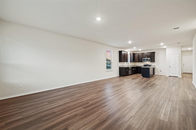 unfurnished living room with hardwood / wood-style flooring