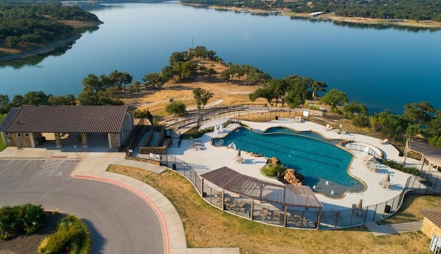 birds eye view of property with a water view