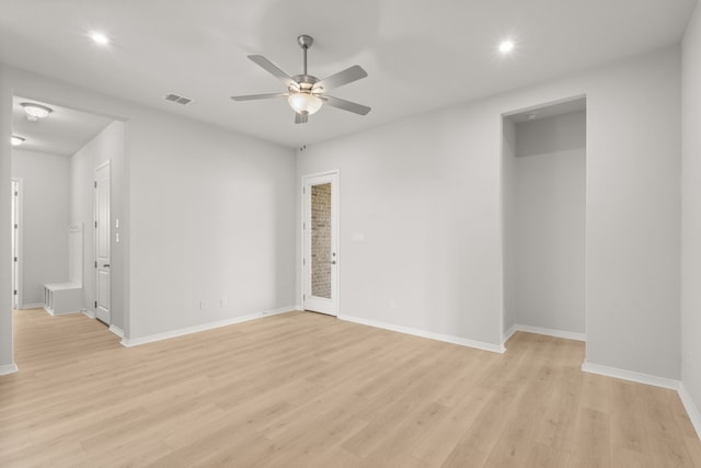 spare room featuring ceiling fan and light wood-type flooring