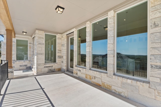 view of patio featuring a balcony