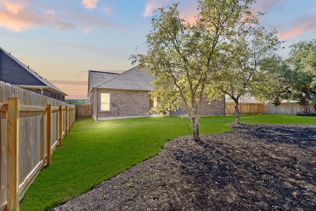 view of yard at dusk