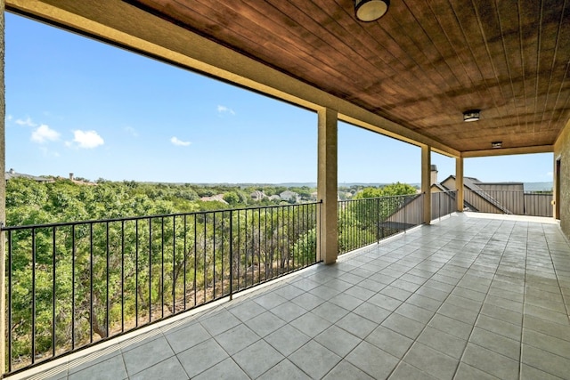 view of patio featuring a balcony