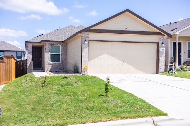 ranch-style home featuring a garage and a front lawn