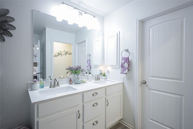 bathroom featuring dual vanity