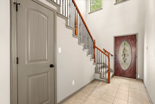 foyer entrance with light tile patterned floors