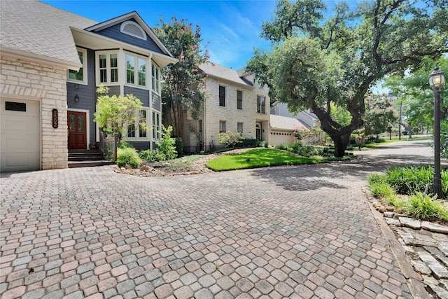 view of side of property with a garage