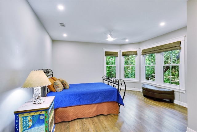 bedroom featuring wood-type flooring and ceiling fan