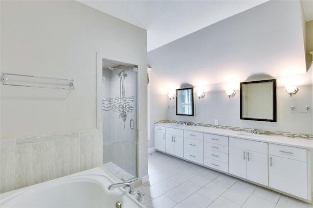 bathroom featuring tile patterned flooring, vanity, and separate shower and tub